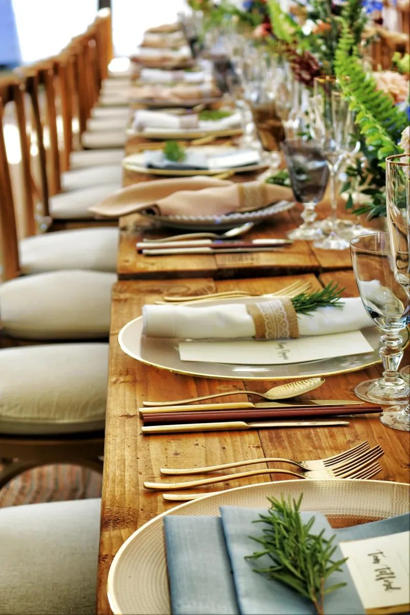 Candlelit floral table setting prepared for guests